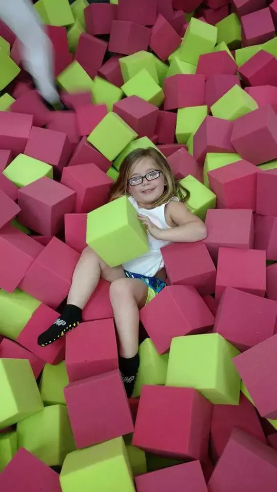 girl in foam pit