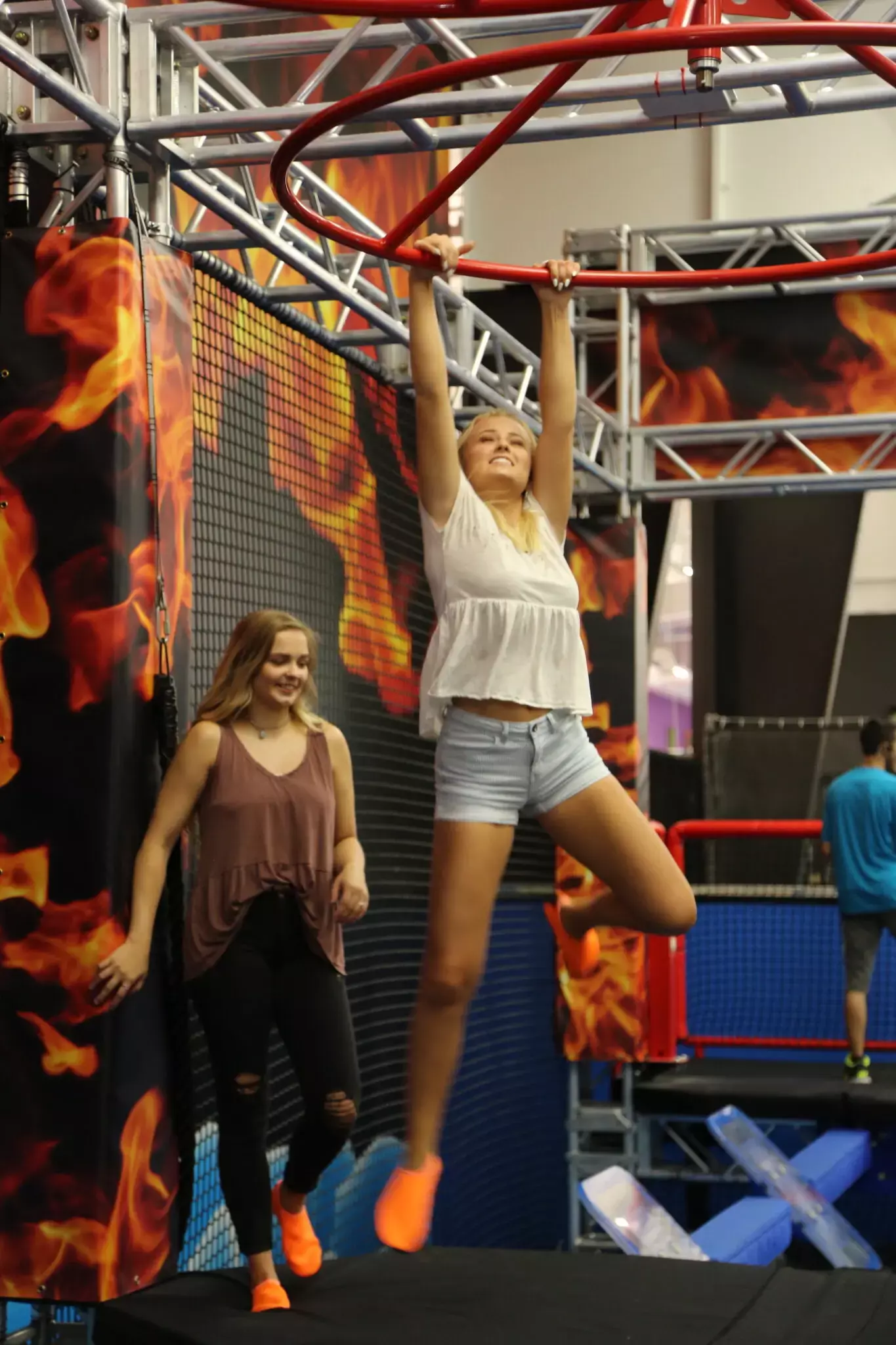 swinging on obstacle of Fire & Ice Ninja Course