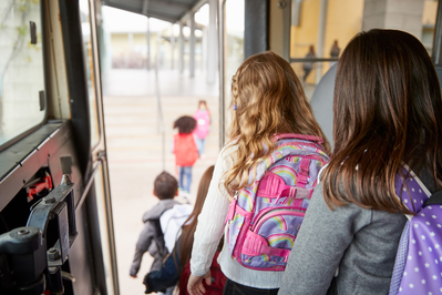 kids getting off bus for field trip